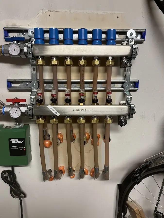 Plumber performing Water Heater Repair at a residential property in Roanoke